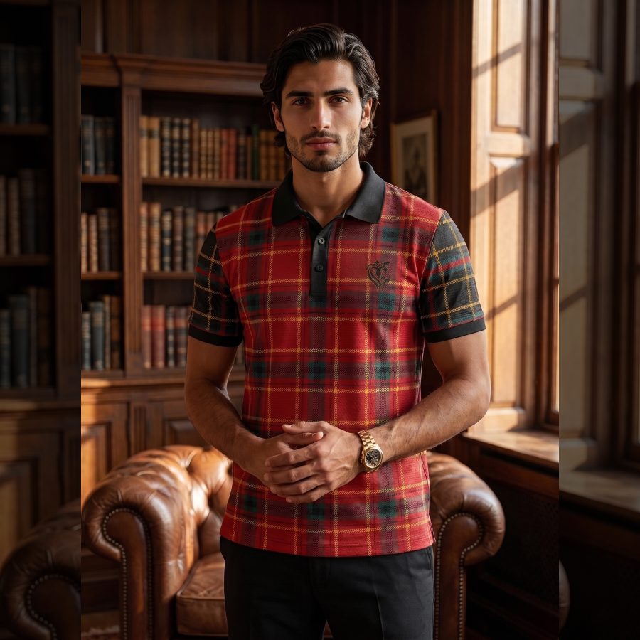 Front view of a man wearing a red, green, and black plaid polo shirt with a black collar, standing in a classic library setting.