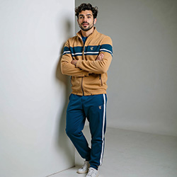 Man posing confidently in the stylish Dune Winter Tracksuit Pakistan.