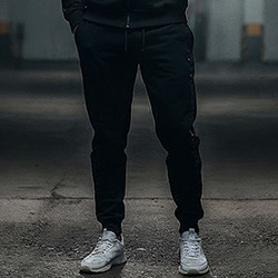 Model wearing Phantom fleece black joggers pakistan in an urban setting