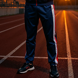 Close-up of The 88 retro track pants pakistan side stripes