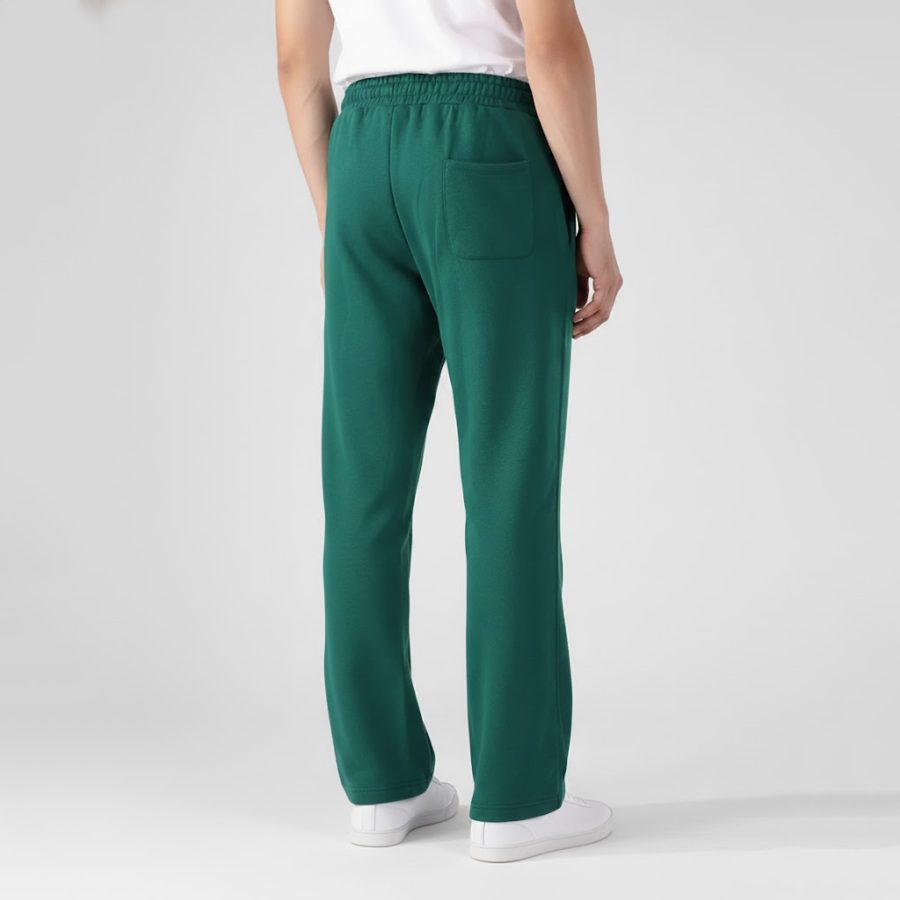 Back view of green mens terry trousers showing the back pocket and relaxed fit.