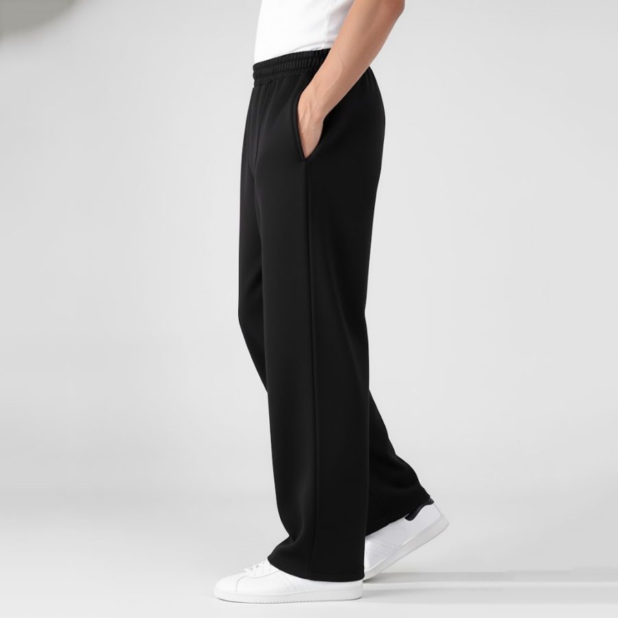 Side profile of mens terry trousers (black) showing the straight-fit relaxed leg and side pocket.