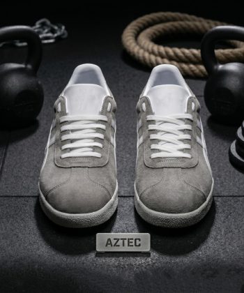 Front view of Aztec grey suede trainers showing white laces and suede toe box