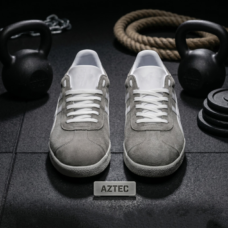 Front view of Aztec grey suede trainers showing white laces and suede toe box
